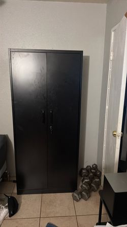 Black metal cabinet four shelves inside
