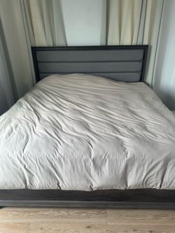 Ashley Furniture King bed set with matching dressers, night stands, and mirror.