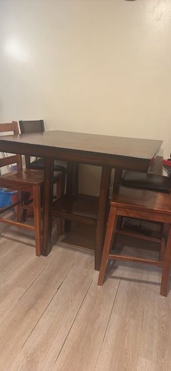 Wooden table and four chairs