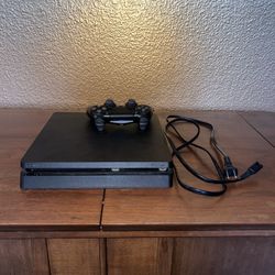 PS4 in great condition, minimal usage, minor scuffs. Includes controller and power cord. 