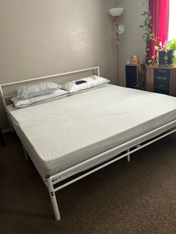 White iron bed, king size with mattress and mattress cover, but you have to take it down when you come to see it or get it if you want it