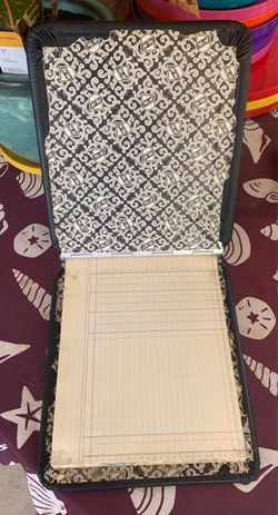 Vintage  accounting ledger binder with patterned interior lining and lined columnar record paper