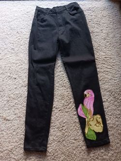 BLACK JEANS WITH PARROT DESIGN