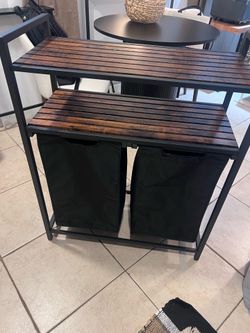 Shelf with laundry baskets
