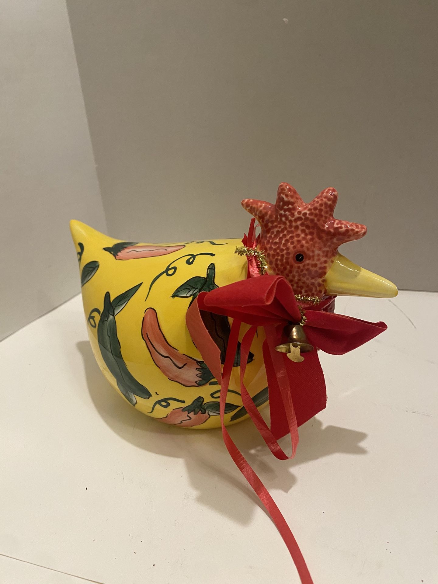 Ceramic chicken statue with chili pepper design. Christmas bow & bell. Southwest/ farmhouse/ cottage
