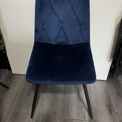 Four royal blue velvet chairs
