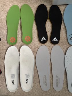 7 pairs of insoles, size 9.  6 are new taken off new shoes