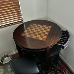 Chess game table and stools.