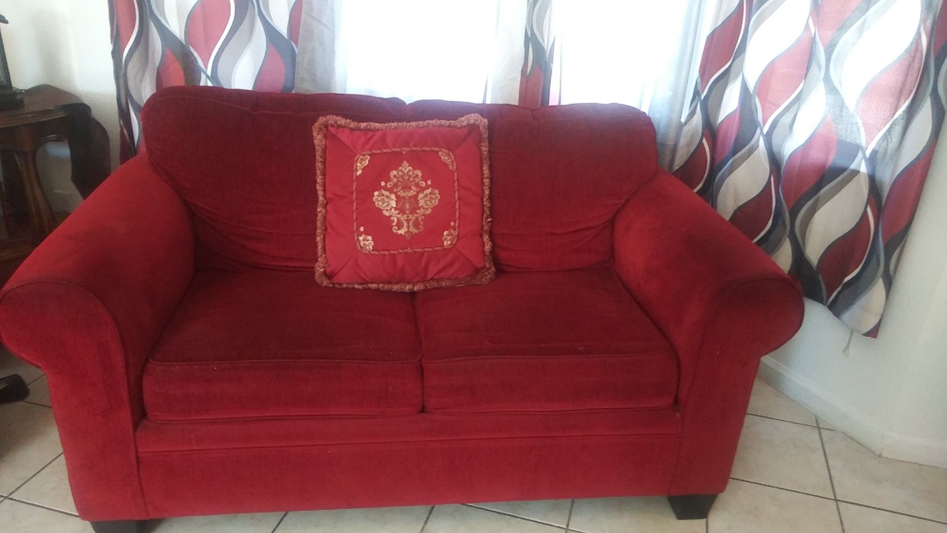 Red couch and loveseat almost new no tears good condition
