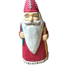 Colonial of Cape Cod Old St. Nicholas taper candle holder. It is a collectible item crafted from ceramic or porcelain.  The figurine is designed in a 
