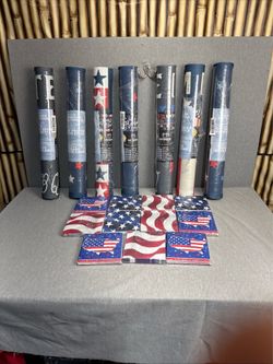 indoor/outdoor door mats and matching patriotic napkins featuring American flag and map designs.