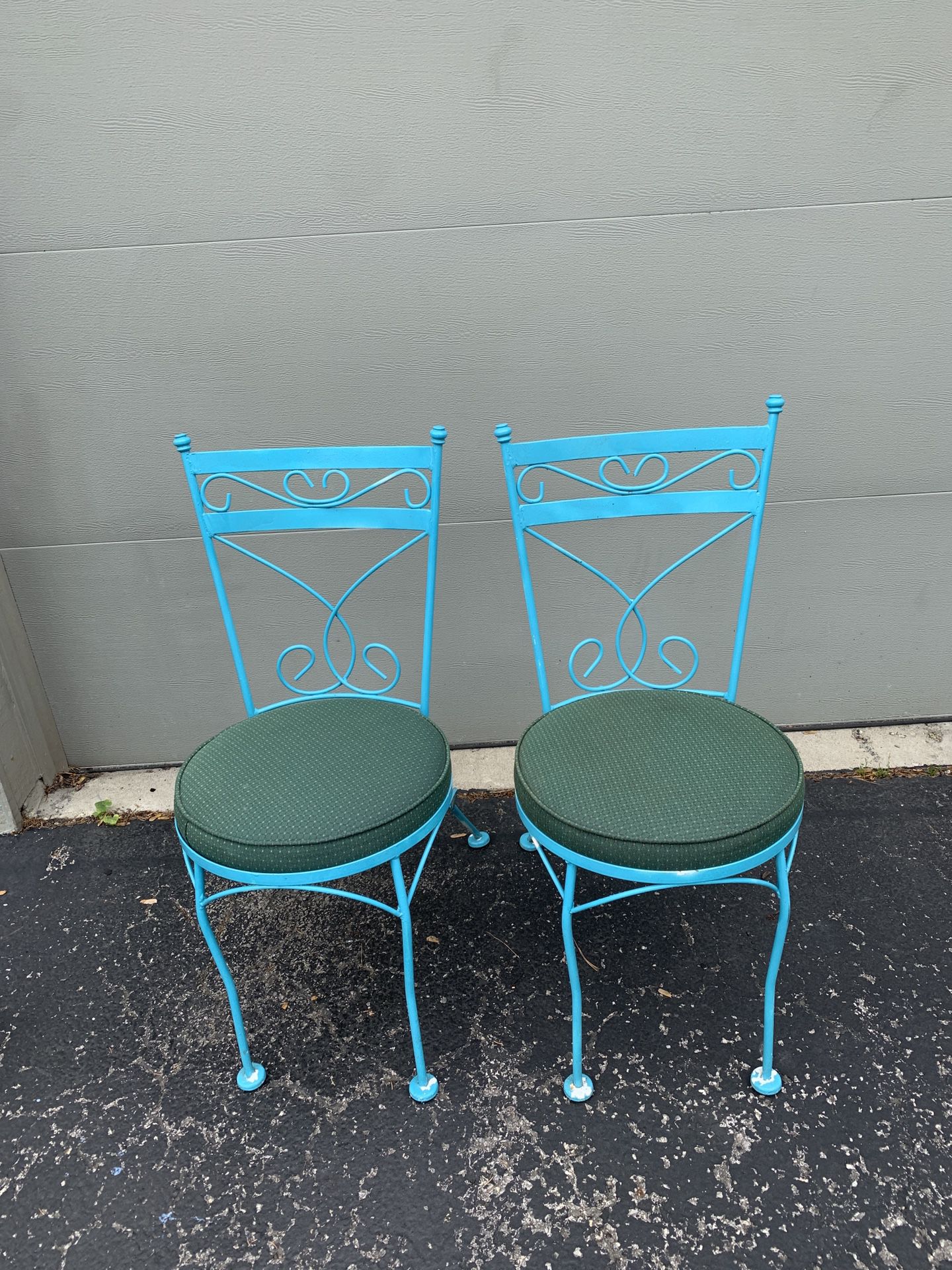 Vintage blue table and chair set with green cushions and 2 chairs.