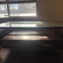 Mahogany Colored Coffee Table, glass Top, Two Drawer Space