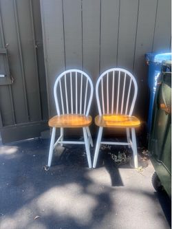 Two wood dining chairs