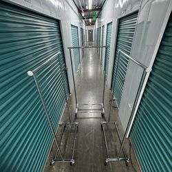 3 metal rolling racks with adjustable bars