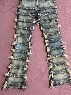 Denim Brain Child Distressed Tiered Jeans With the tag.
