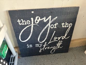rustic wooden wall sign featuring the biblical verse "The joy of the Lord is my strength" (Nehemiah 8:10)