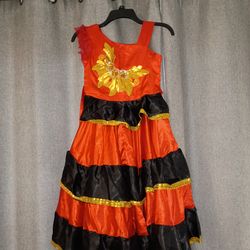 Brand new flamenco dress, along with a hairpiece, fan, and hand covers.