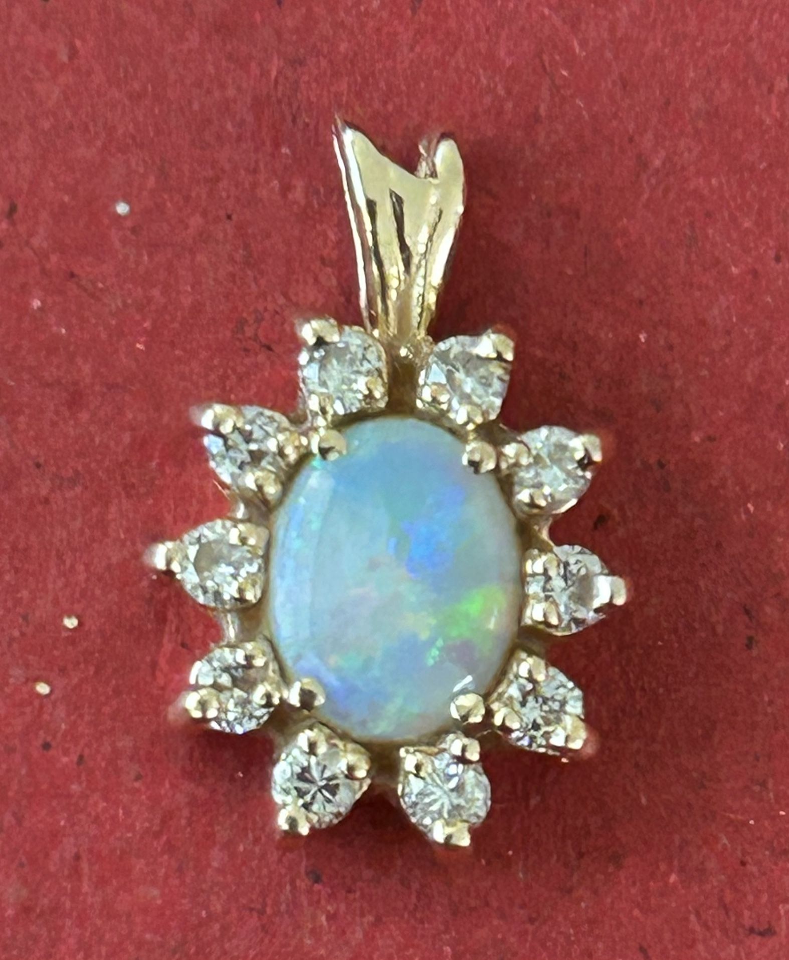 14k Gold Opel Pendant With 10 Diamonds. 2.1g.