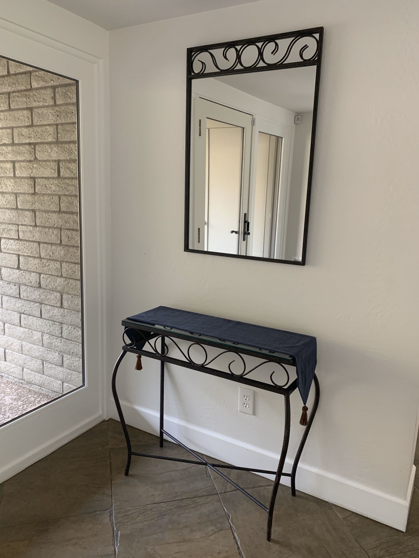 Custom iron mirror with matching glass topped table