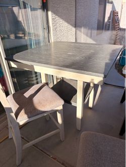 Counter height table with four chairs