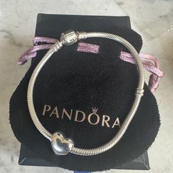 925 Sterling silver Authentic Pandora bracelet , size 7.75 in , marked 925 Ale , barrel lock closure , w/ heart ❤️ Pandora charm
