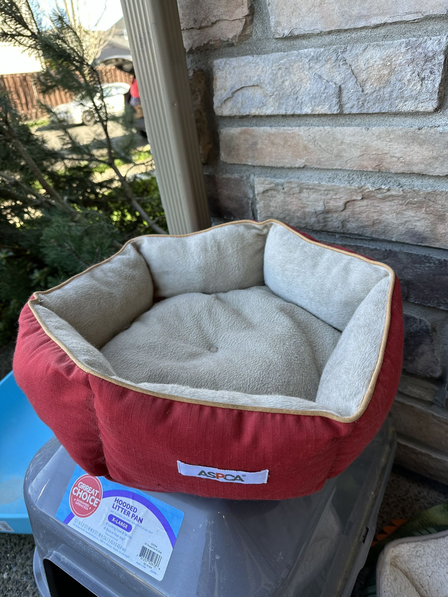 Red circular cat bed - probably medium cat size
