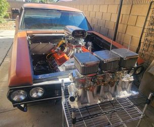 Small block chevy Holley tripower carburetors with manifold