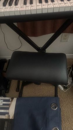 Keyboard, bench and headphones