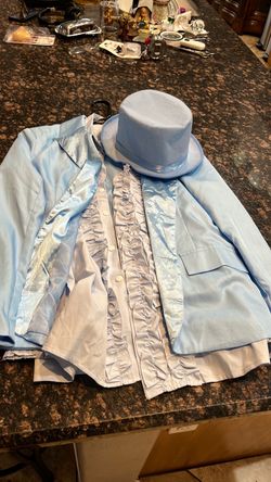 Light Blue Tuxedo Jacket with Ruffle Shirt and Top Hat