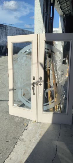Exterior double doors designer glass full view non-impact with one rust spot see photos 32x32x79.5