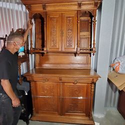 Beautiful bar style 2 piece cabinet. Kings and queens carved into it 52.5" Wide, 21.5" Deep, 86" Tall