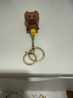Cute capybara with duck keychain