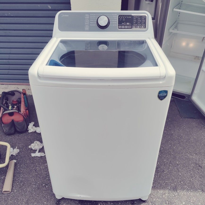 like new Madea top load washer stainless tub no agitator with a comparable dryer works perfect with warranty
