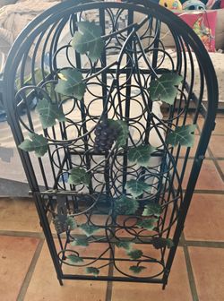 Black metal wine rack grape leaf design