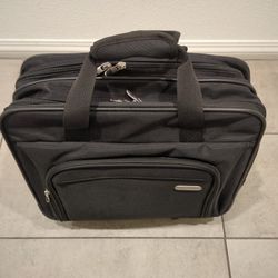 Targus 16 inch Rolling travel laptop case, Black - Travel briefcase and small rolling bag - Spacious foam padded laptop case 16" (TBR003US)