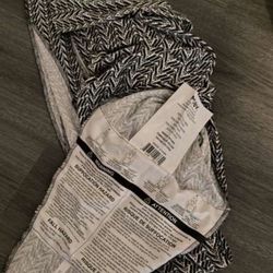 MOBY Baby Wrap Carrier, specifically a special edition collaboration with Petunia Pickle Bottom. 