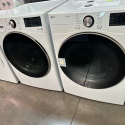 LG Front Load Stackable Washer And Gas Dryer In White 