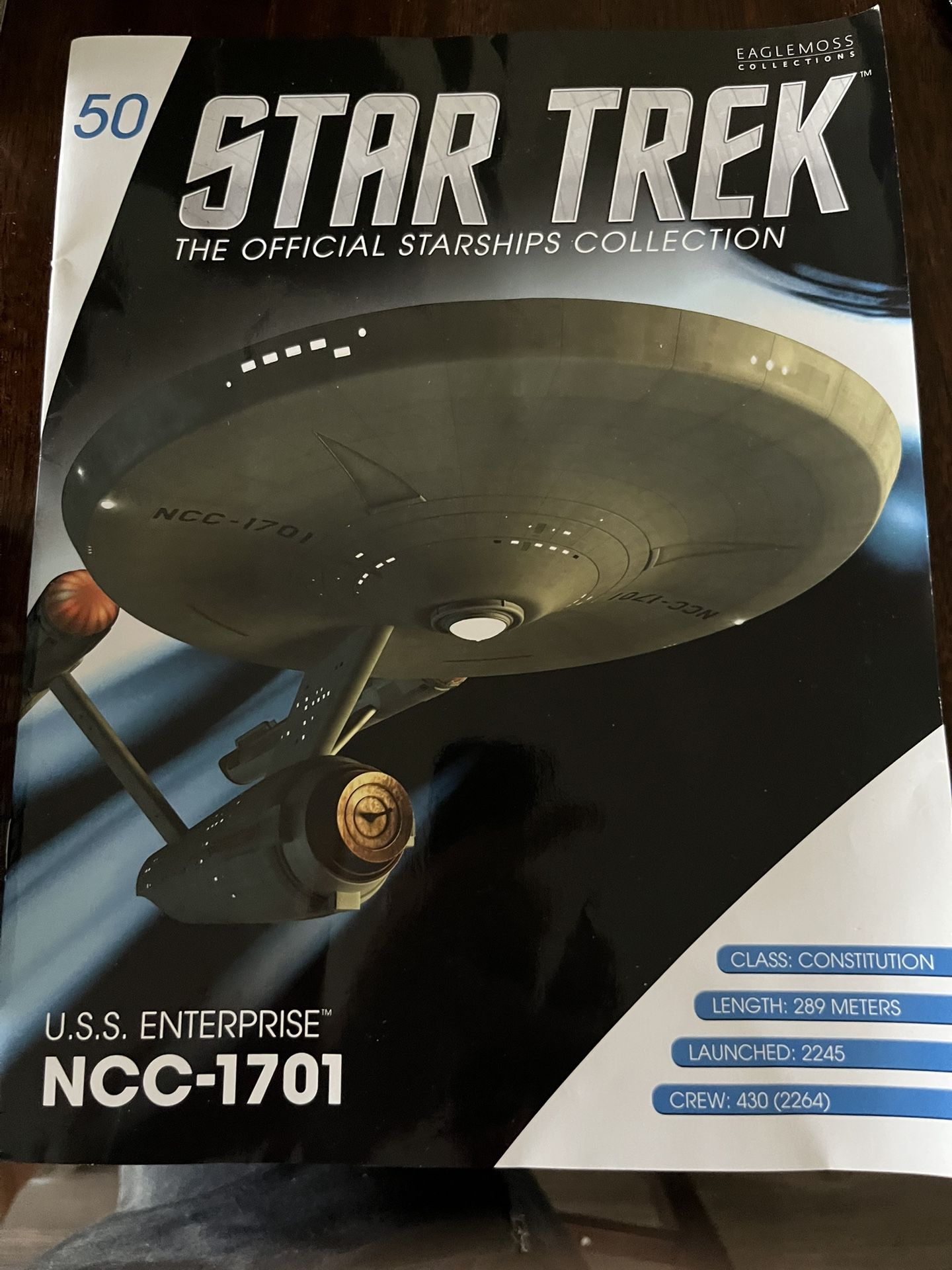 A Model Of USS Enterprise With The Book