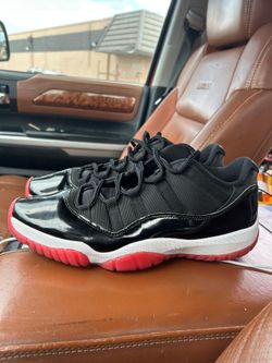 Air Jordan 11 Retro Low "Bred" (specifically the 2025 version, style code FV5104-006).Air Jordan 11 Retro Low "Bred" (specifically the 2025 version, s