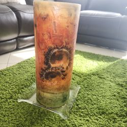 Beautiful orange candle, 19 inches high and 8 inches in diameter, in good condition.