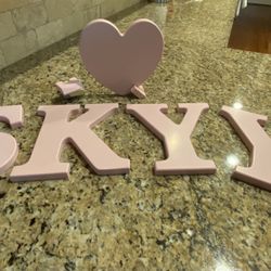 Wood Pink Letters w/Heart (Name SKYY or SKY). They can be hung up on wall.  8”L x 8”W