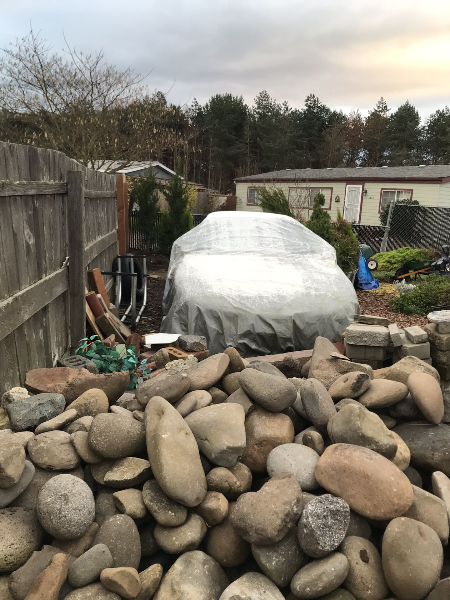 River Rocks for sale the hole pile $500 and that’s a hell of a deal because payed $600 a pallet paletteoo to landscape my yard with them and have too