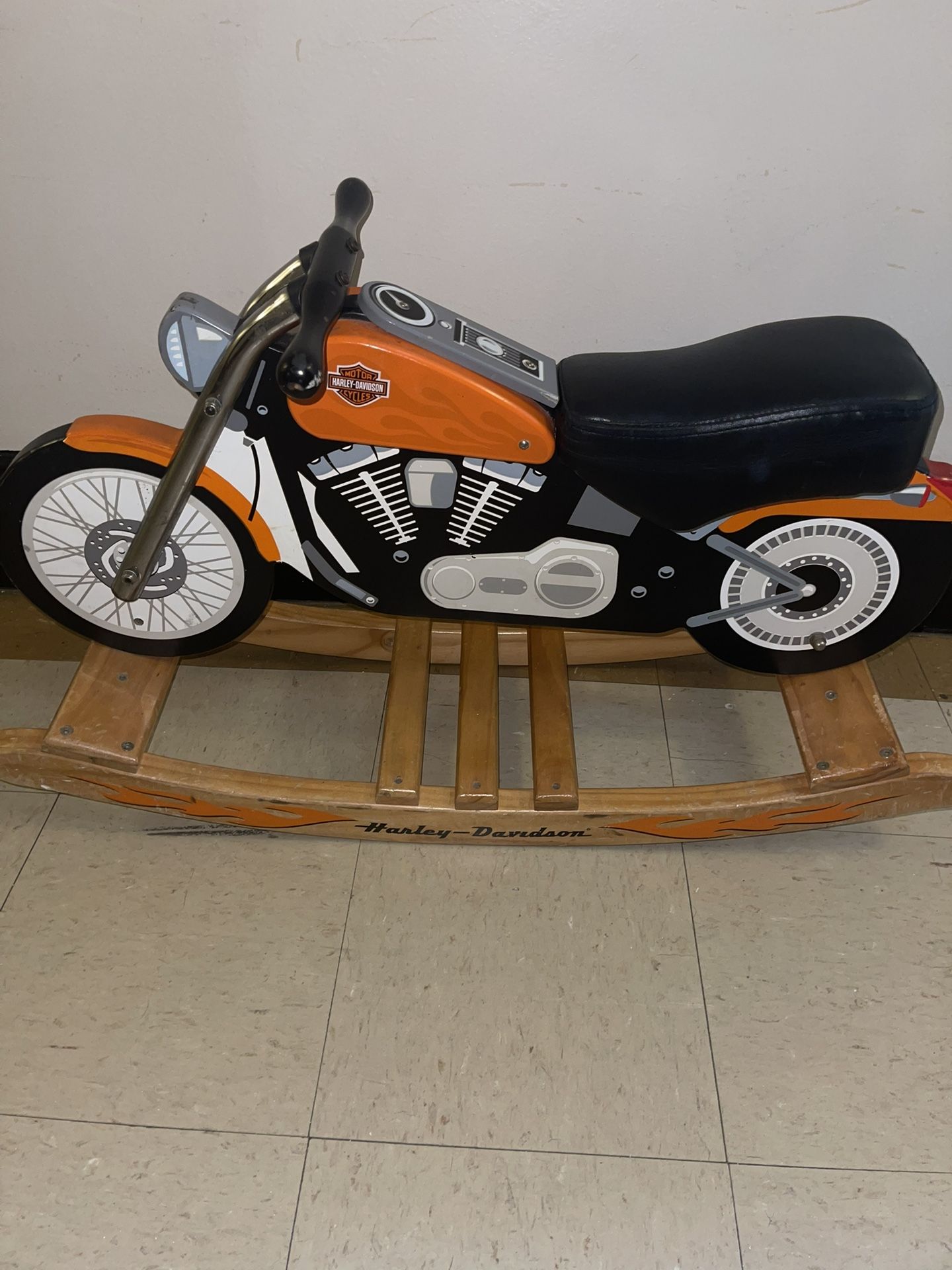 This is a Charm Company Harley-Davidson Roaring Softail Rocker, a children's rocking toy designed to resemble a Harley-Davidson motorcycle. It is made