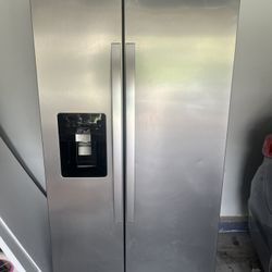 Monochromatic Stainless Steel Whirlpool 25 cu. Ft. Side By Side Refrigerator 