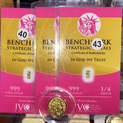 1/100th day of the dead gold coin and four individual 1/4 grain gold