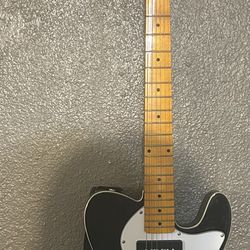 Electric Guitar With Amplifier And Guitar Hook