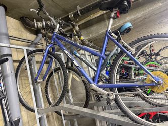vintage blue GT Outpost Trail mountain bike (approx. late 1990s model) with a steel/chromoly frame and 26-inch wheels