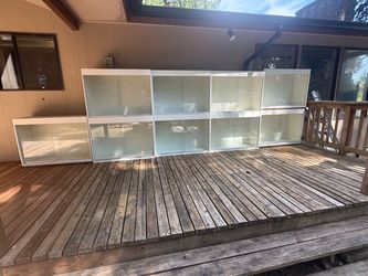 Vintage custom white modular display cabinets with sliding glass doors