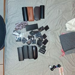 Lot Of Sunglass Casses And Rags To Clean Glasses